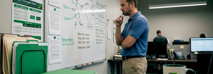 Fleet manager reviewing cargo insurance documents