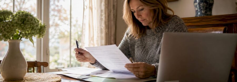 Homeowner reviewing flood insurance papers