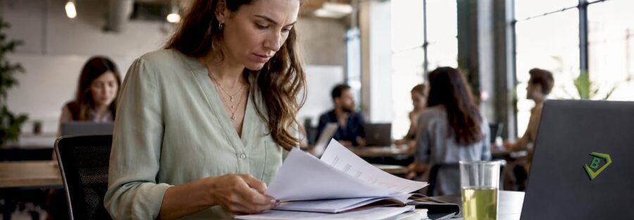 Female insurance underwriter reviewing applications