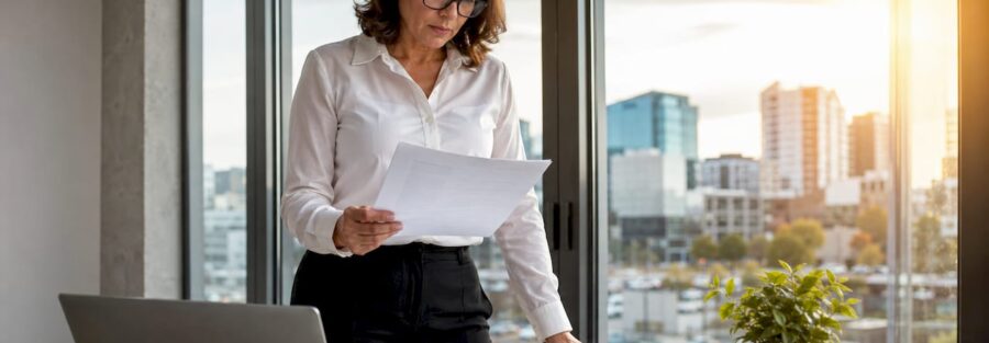 Fleet manager reviewing trucking insurance papers