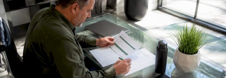Trucking policyholder reviewing insurance papers