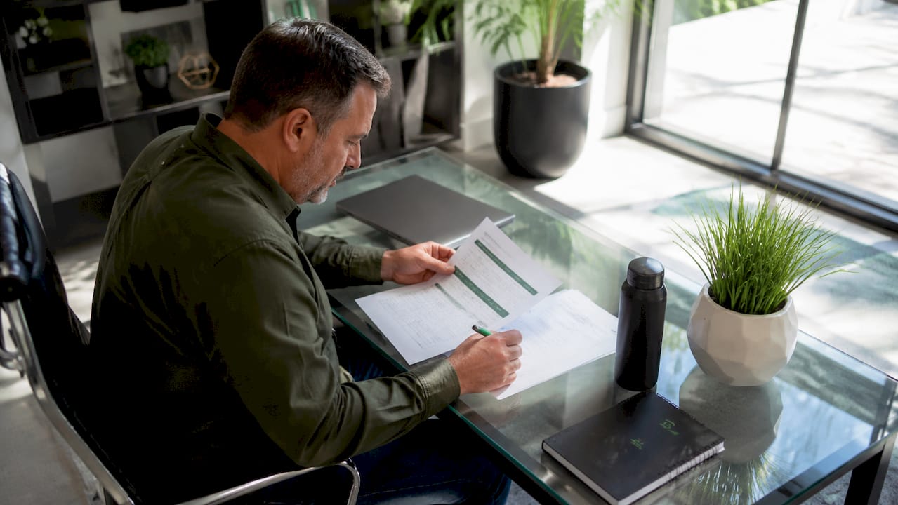 Trucking policyholder reviewing insurance papers