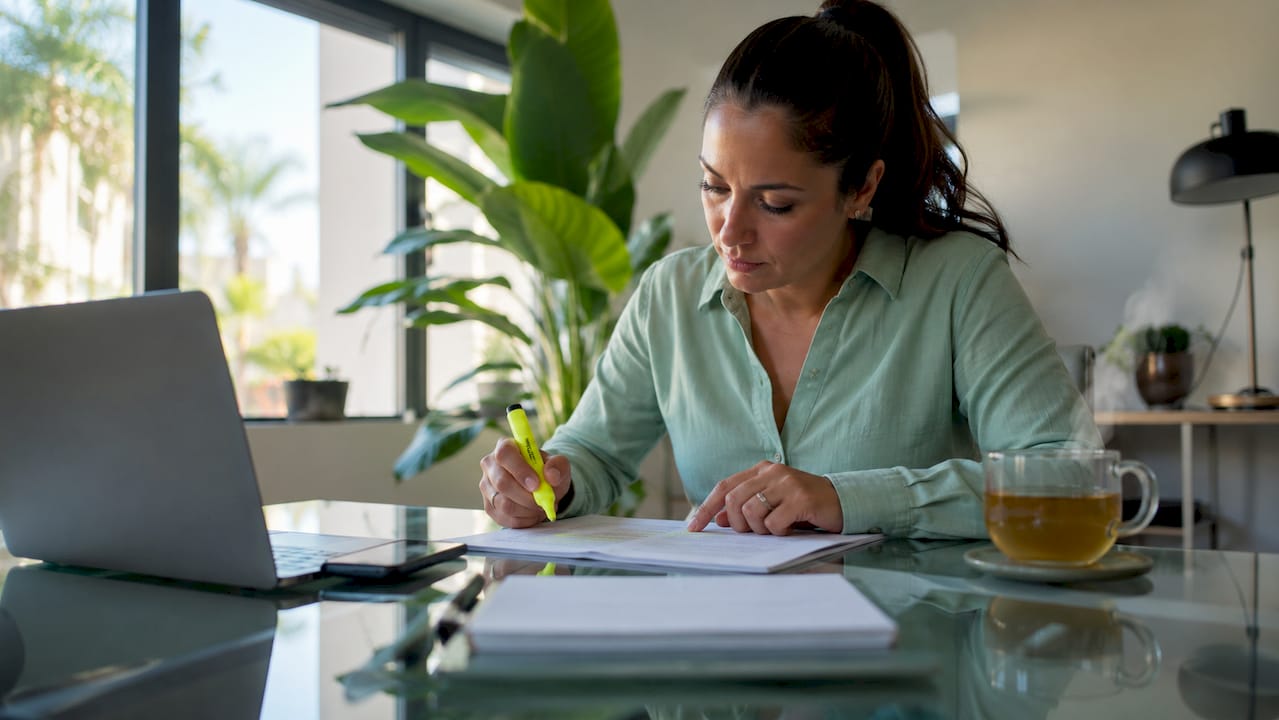 Woman reviewing trucking insurance documents