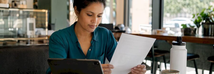 Business owner reviewing auto insurance documents