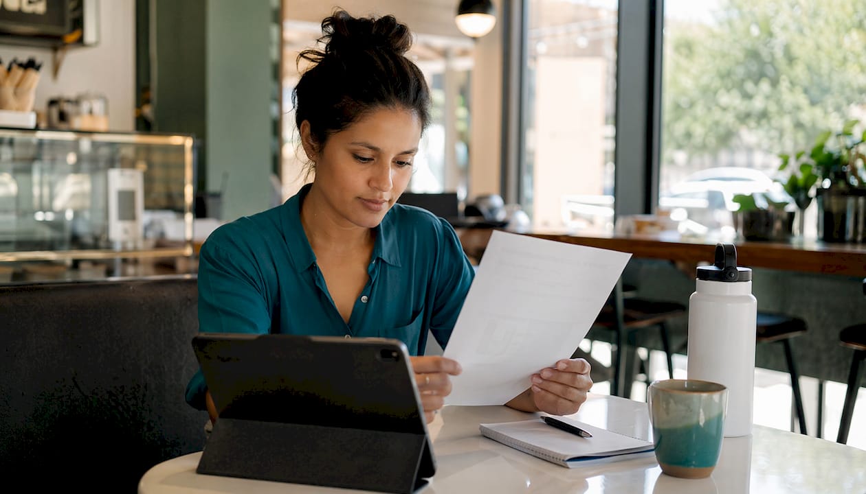 Business owner reviewing auto insurance documents