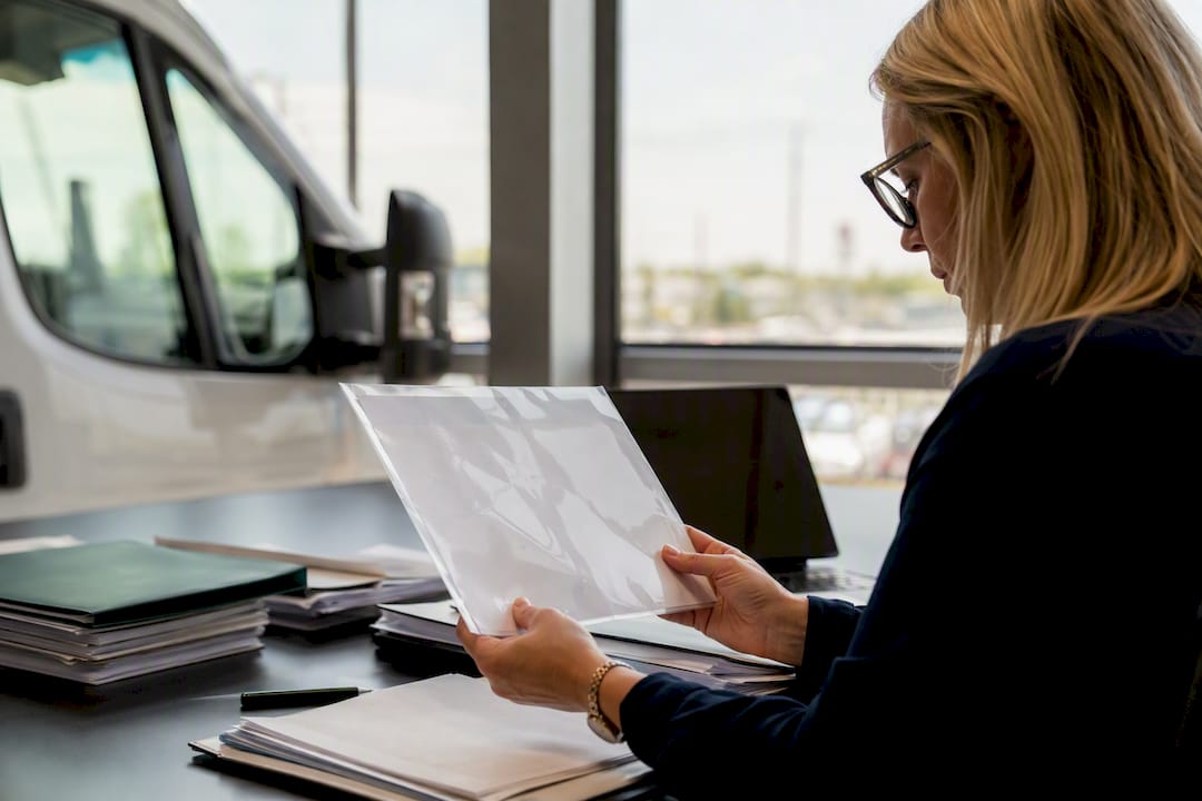 Fleet manager checking insurance certificate endorsements