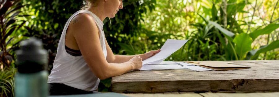 Fitness instructor filling insurance forms at desk