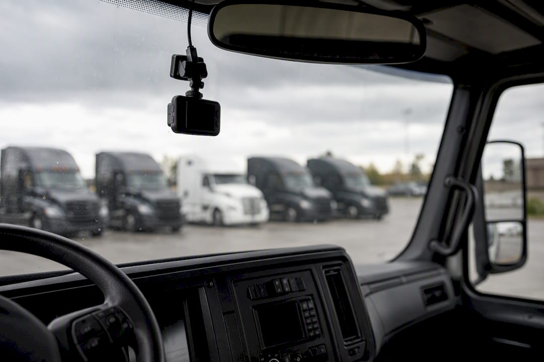 Dash cam mounted on truck dashboard