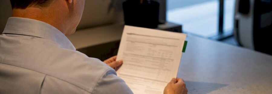 Fleet manager reviewing commercial auto coverage document