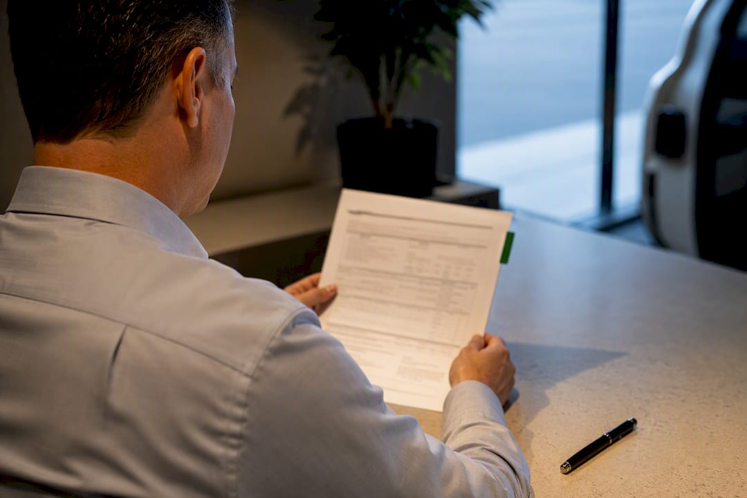 Fleet manager reviewing commercial auto coverage document